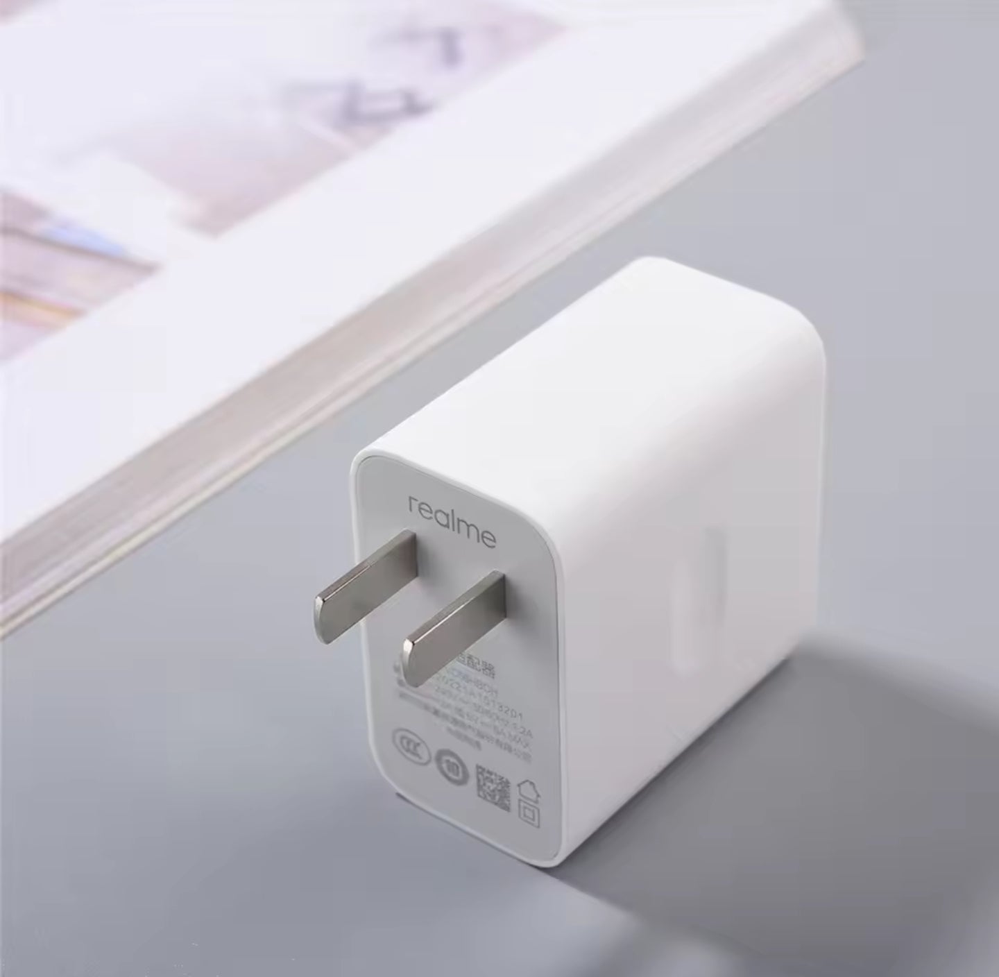 Realme 30W VOOC fast charging adapter with compact design and high-speed charging capabilities for optimal device performance 